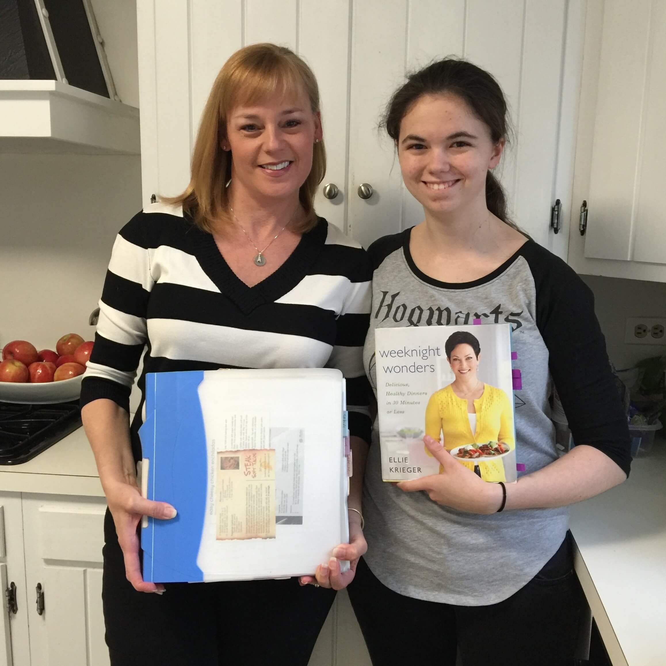 Melissa with the "ginormous" binder and Sarah with Ellie Krieger's Weeknight Wonders Cookbook